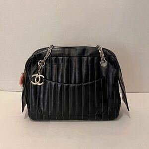 CHANEL Black Quilted Leather Shoulder Bag with CC Charm and Front Pockets
